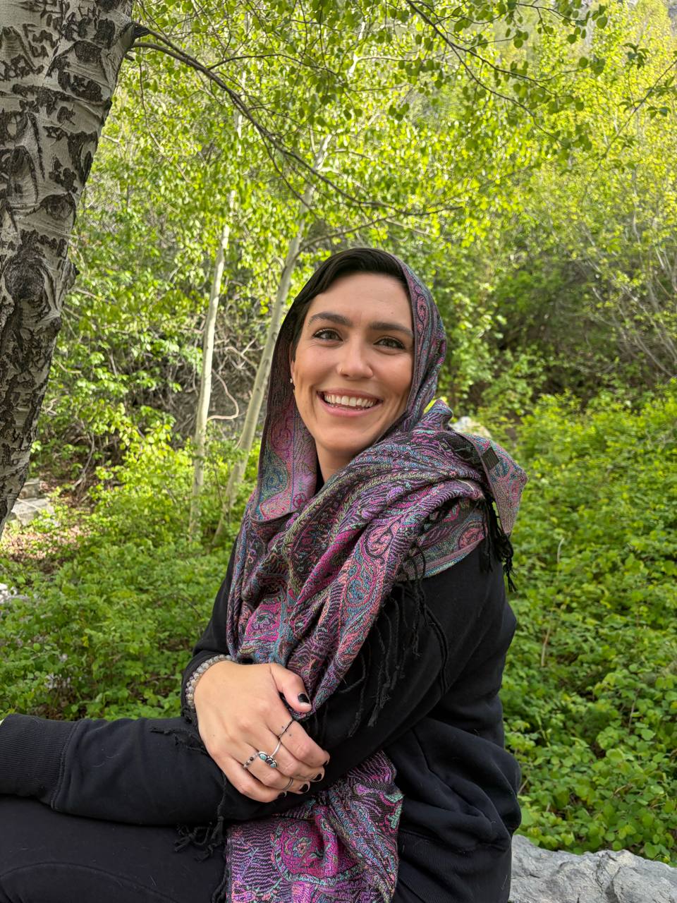 Jana, founder and sole leader of ALIRA, among aspen trees